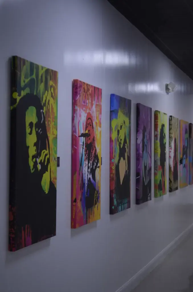 Colorful wall art at Nuna Harvest featuring music and cultural icons