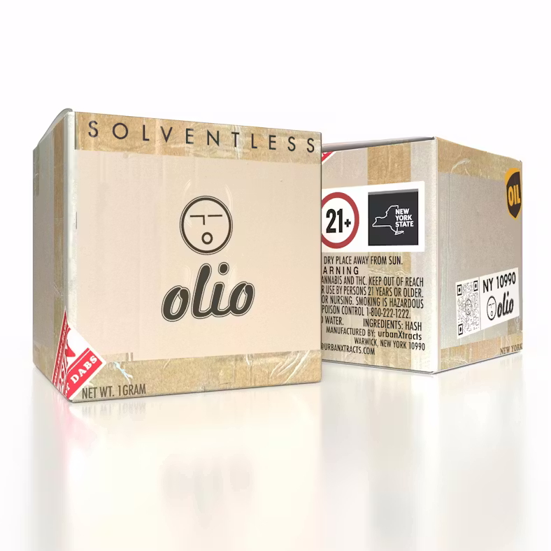 Two light-colored square boxes with "Olio" branding and graphics, positioned next to a small black container on a white reflective surface.