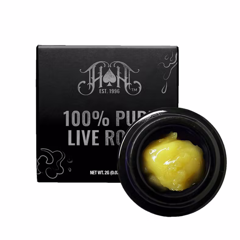A black square box featuring white text "100% Pure Live Rosin" and the "ProXtracts" logo, placed near an open container with yellow concentrate.